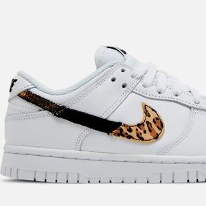 Limited edition leather and animal print Nike sneakers. Brand new in box.